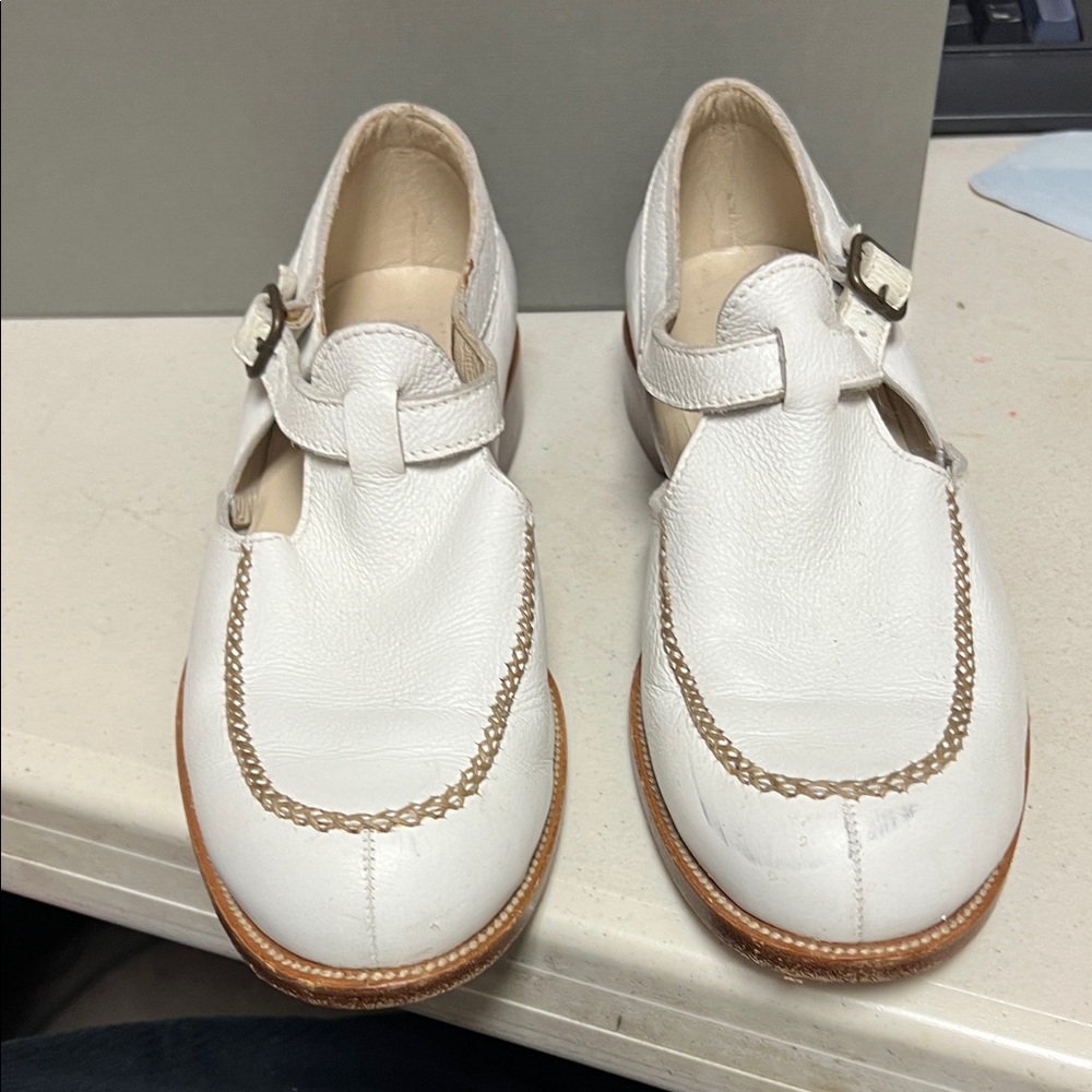 White Leather Buckle Shoes by Henry Beguelin.